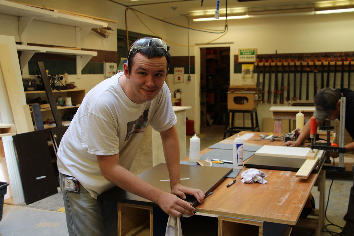 Andrew Dupris is a student at the DI Woodwork Shop. He put in many hours making the Social Work Keys.