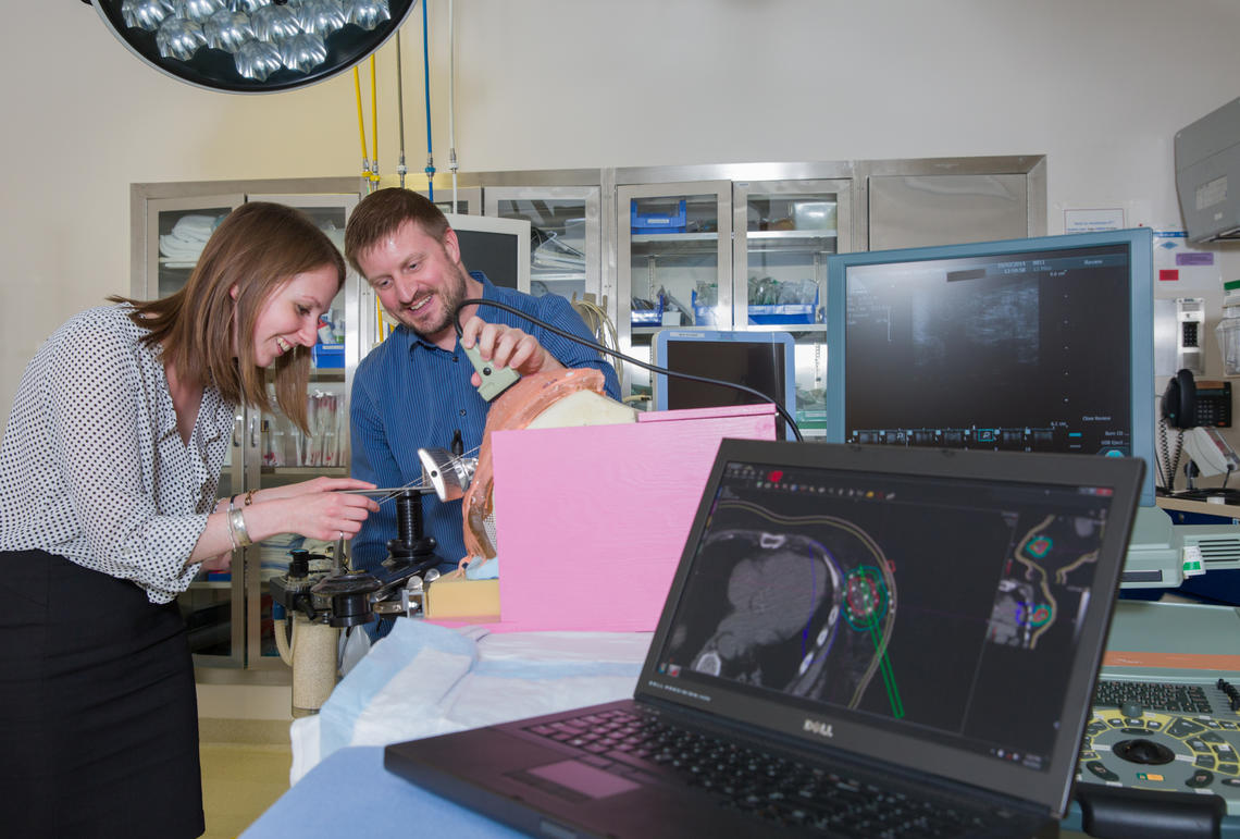 Elizabeth Watt, an MSc student specializing in radiation oncology physics in the Department of Physics and Astronomy, works with Tyler Meyer, an adjunct assistant professor in the  Department of Physics and Astronomy.