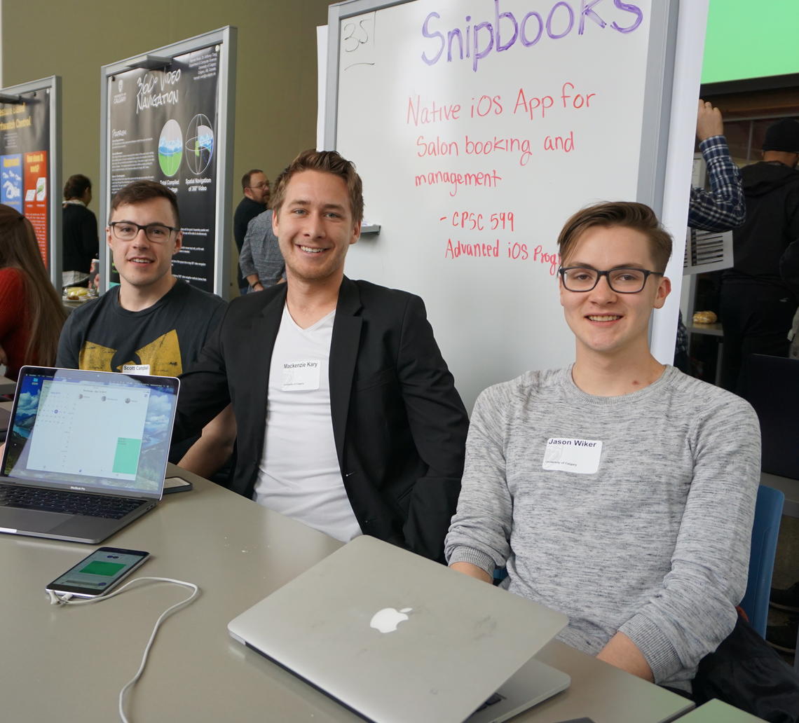 Snipbooks team members, from left: Scott Campbell, Mackenzie Kary and Jason Wiker at the April 13 Computer Science Showcase. Missing team members are Patrick Czeczko and Ryan Newhouse. 