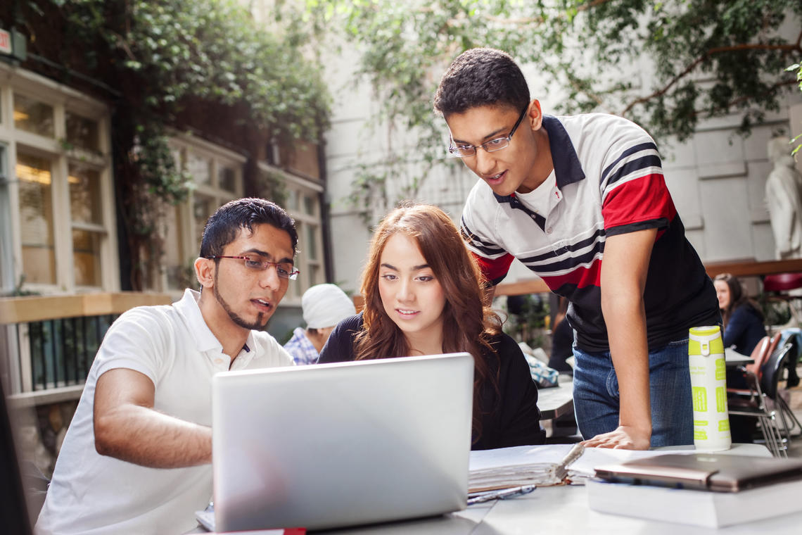 students looking at a computer