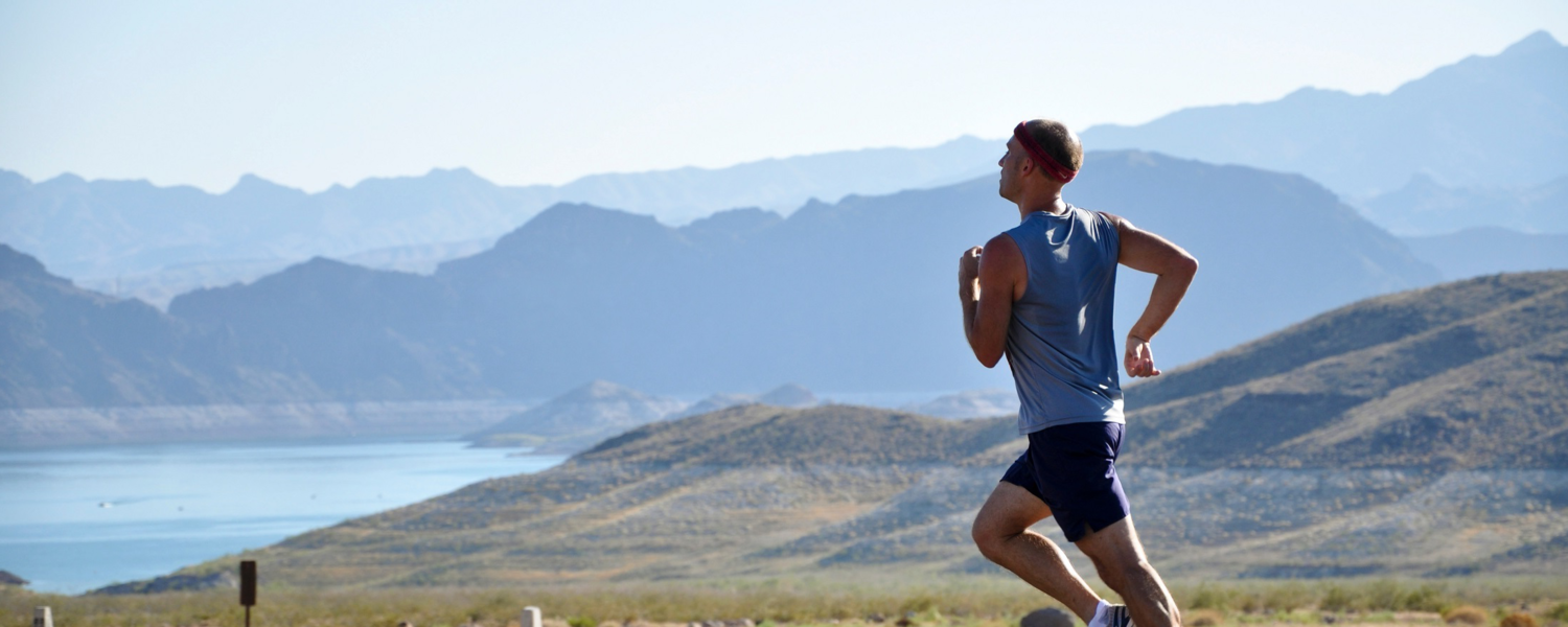 Man running in the mountains.