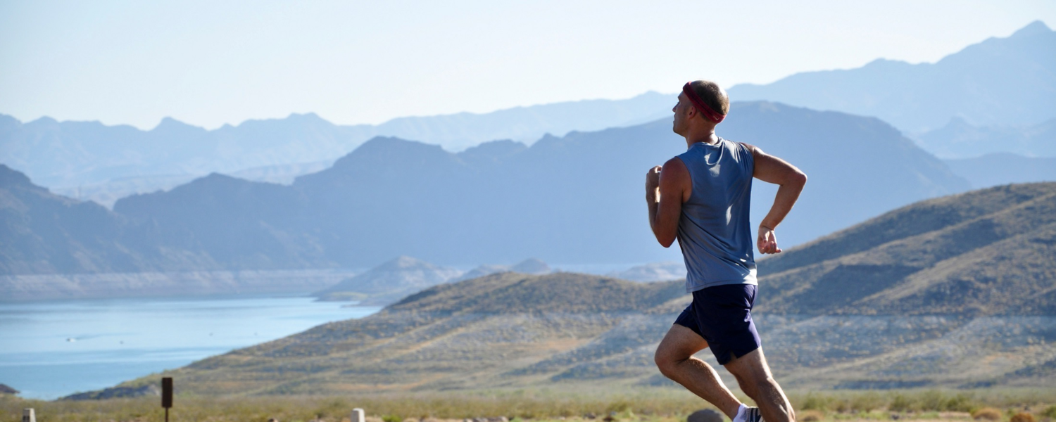 Man running in the mountains. 