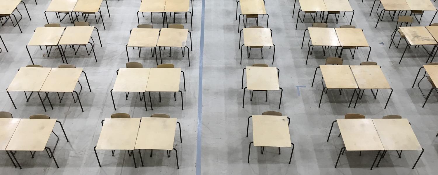 rows of desks set up for exams