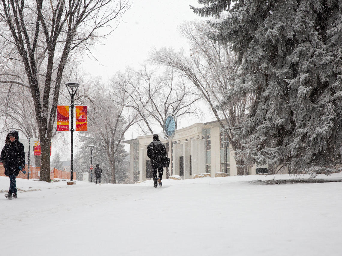people walking on main campus in winter