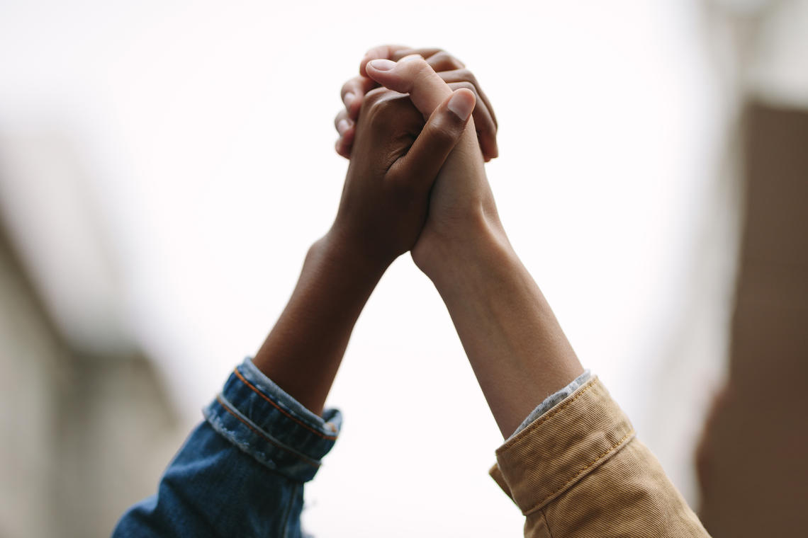 Holding hands to show support