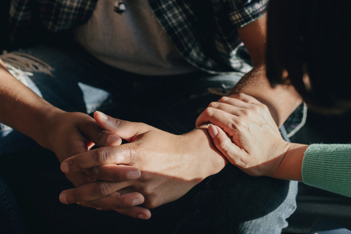 one person comforting another 