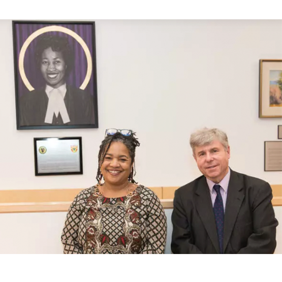 Jo-Anne Henry and UCalgary Law Dean Ian Holloway pose with the new portrait of Violet King Henry.