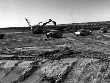 An excavator works to prepare the site for UCalgary's first buildings, now Admininstration and Science A, 1959.