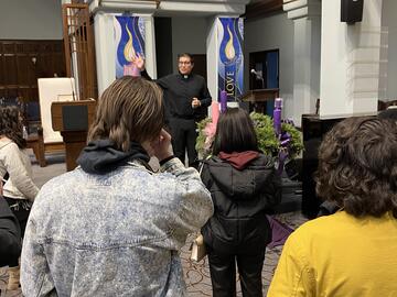 Priest gives tour to students