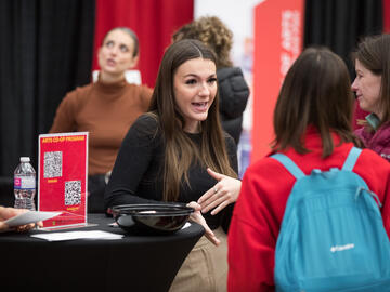 UCalgary staff member speaking with prospective student
