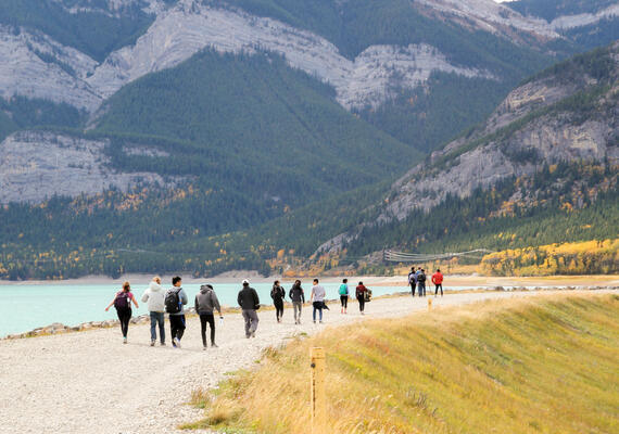 A group of students walking next to Barrier Lake