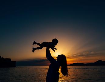 Mother and child in sunset