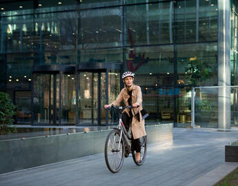 Woman on bike in a city. 