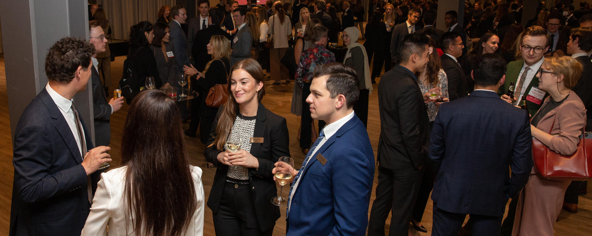 Students and lawyers mingle at a networking reception