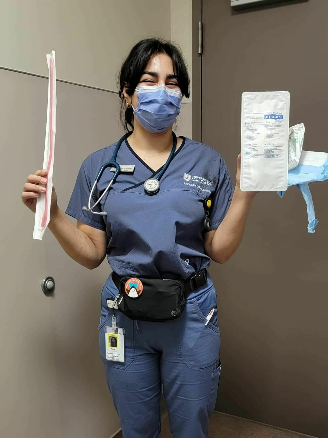 Nurse holding catheterization supplies in hospital