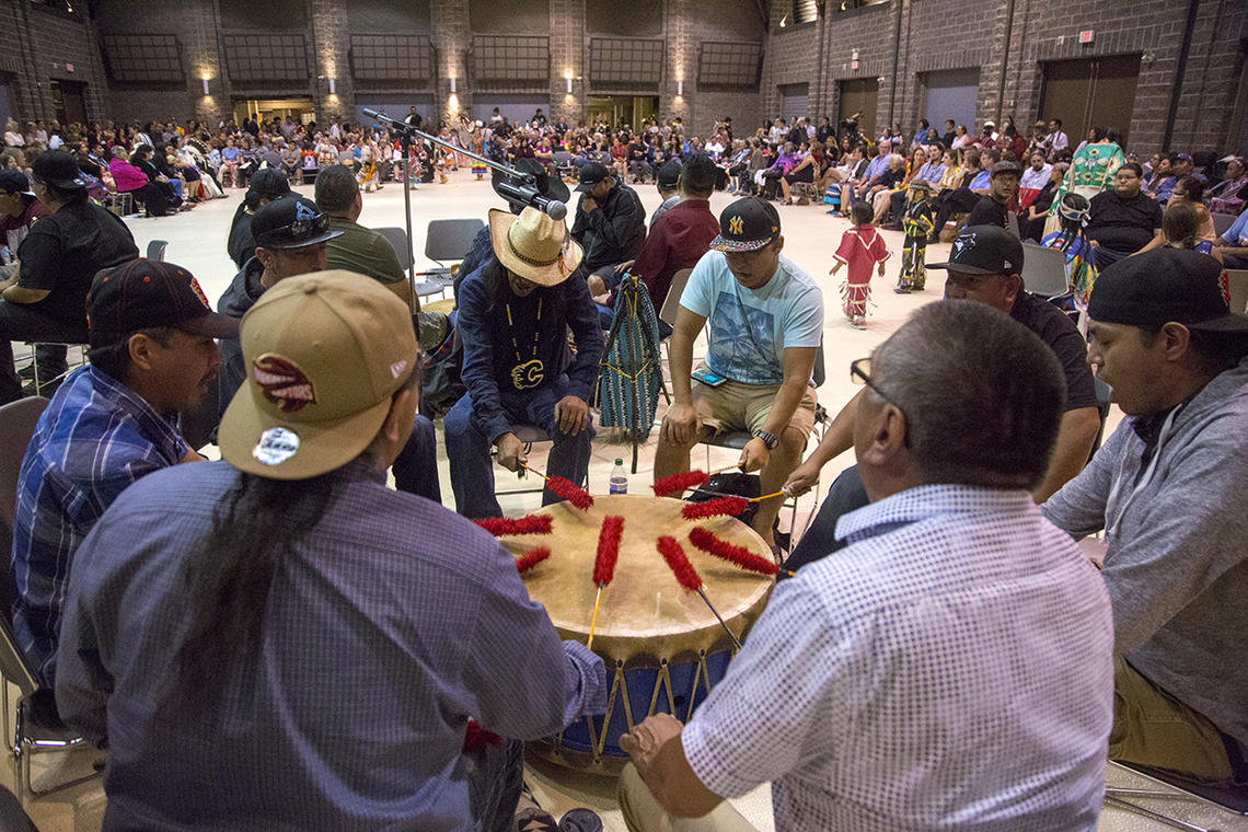 A drum group performs at UCalgary's Indigenous Graduation Powwow on June 2, 2018. 