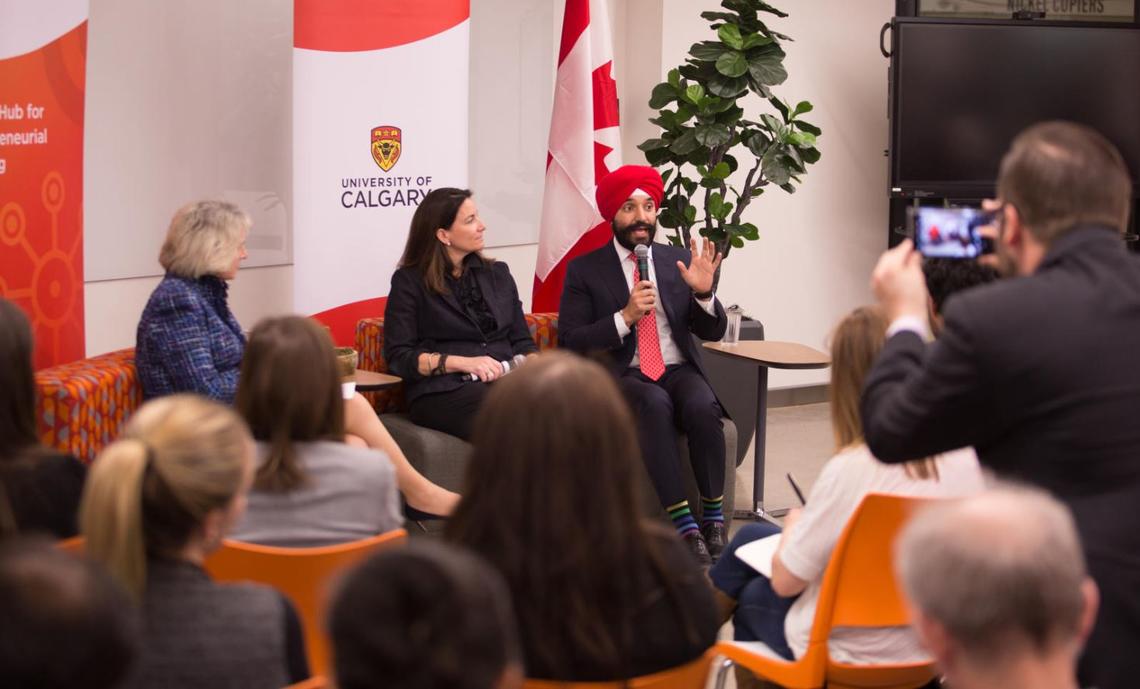 University of Calgary President Elizabeth Cannon, left, Creative Destruction Lab – Rockies associate director Alice Reimer, and Minister of Innovation, Science and Economic Development Navdeep Bains spoke to an audience at the Hunter Hub for Entrepreurial Thinking.
