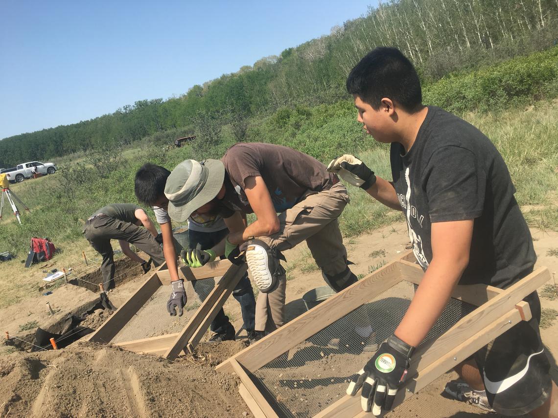 High school students participate in an archaeology excavation of the Cluny Fortified Village as part of the University of Calgary's Program for Public Archaeology and its Aboriginal Youth Engagement Program.
