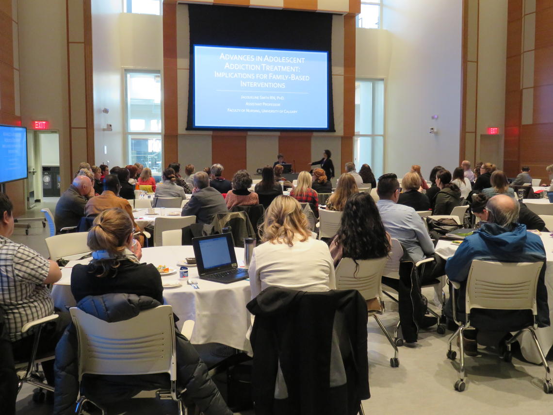 Participants listen intently.