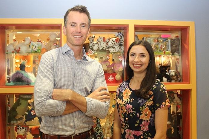 Adam Kirton supervises trainee Asha Hollis, who is setting up a clinical trial to analyze brain and muscle activity in children. 