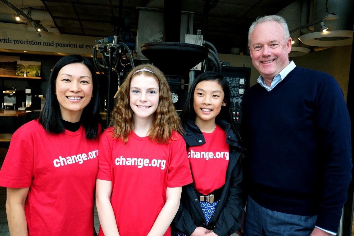 From left, Gina Ko, Eve Helman and Mya Chau with Starbucks CEO Kevin Johnson at the company’s headquarters in Seattle on March 21, 2018.