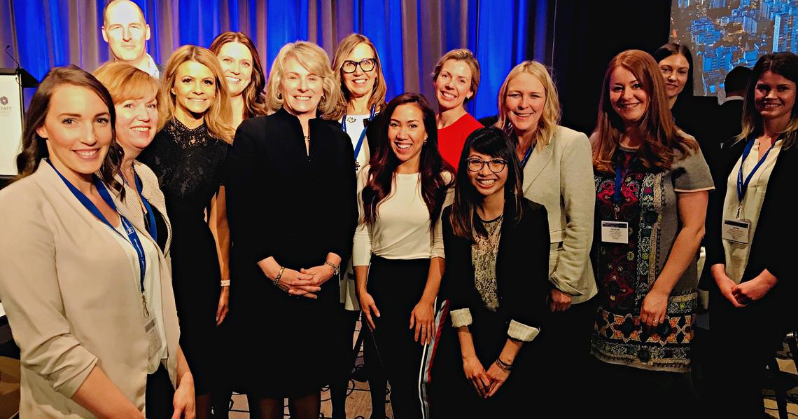 President Emerita Elizabeth Cannon celebrates her leadership award with University of Calgary communications, marketing and development staff at the CASE District VIII conference in Vancouver.