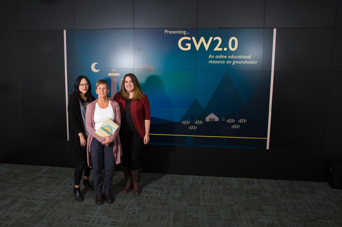 Interns Aimee Lo, left, and Tory LaLiberte, right, are developing a web version of the hydrogeology textbook Groundwater under the supervision of Cathy Ryan, a professor in the Department of Geoscience and administrative director of the GW2.0 project.