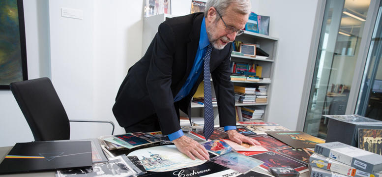 Tom Hickerson, vice-provost (libraries and cultural resources), examines items in the EMI Music Canada Archive.