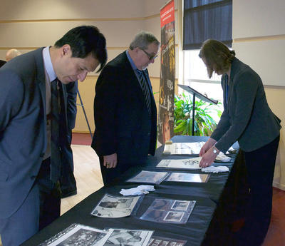 Jeffrey Remedios, president and CEO of Universal Music Canada, left, and Deane Cameron, former president of EMI Music Canada, peruse archival materials from the EMI Music Canada Archive.