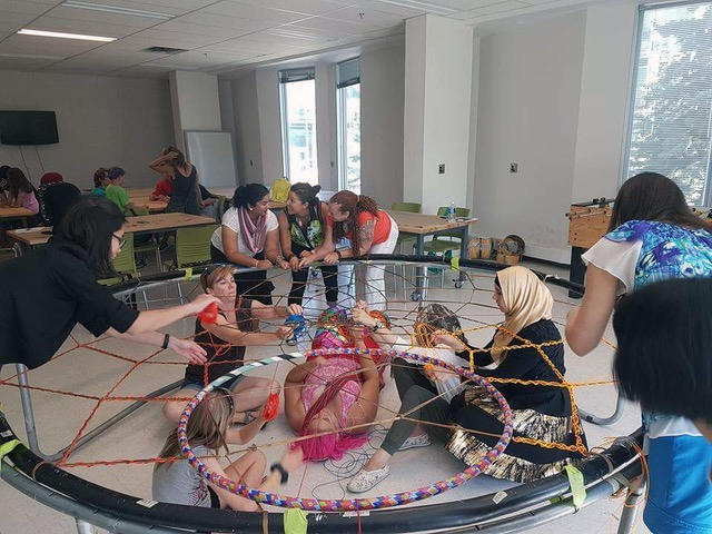Volunteers from numerous on-campus and off-campus organizations helped craft the Rings of Reconciliation dreamcatcher.