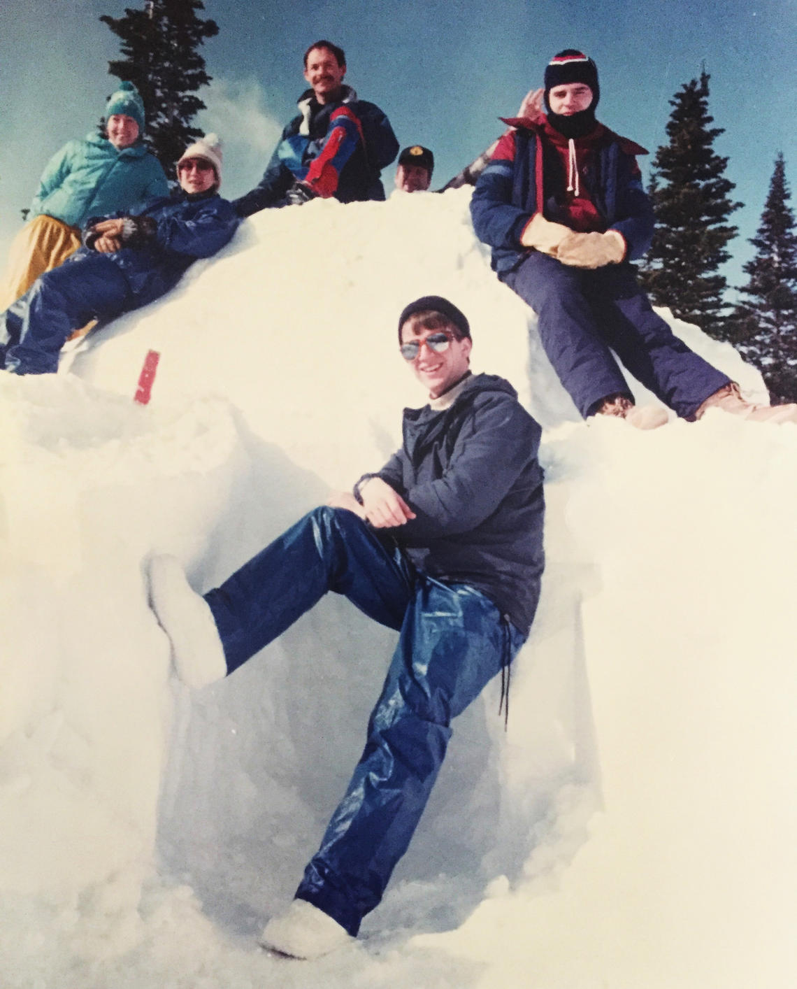 Founding member of the University of Calgary Outdoor Centre Alf Skrastins, top, with other outdoor enthusiasts in a snow shelter. 