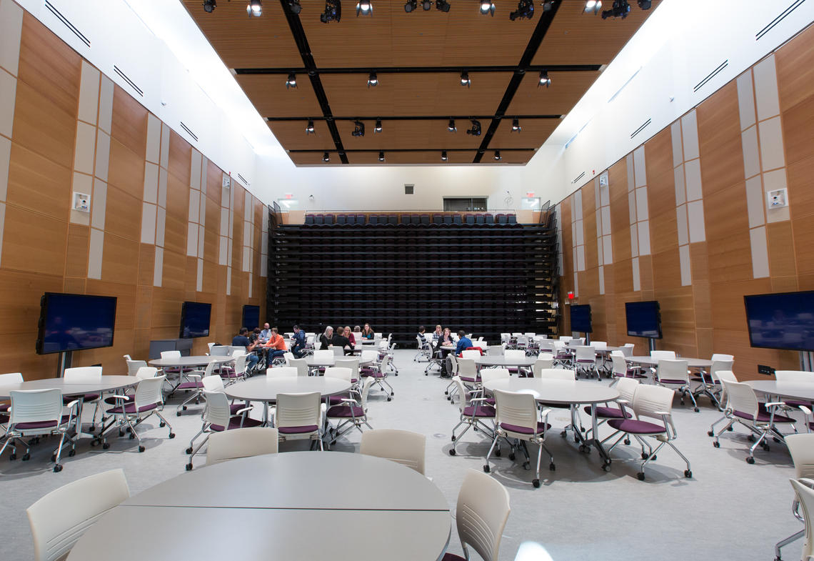 The forum has retractable seating that allows it to convert from a public lecture space to a flat-floor learning space.