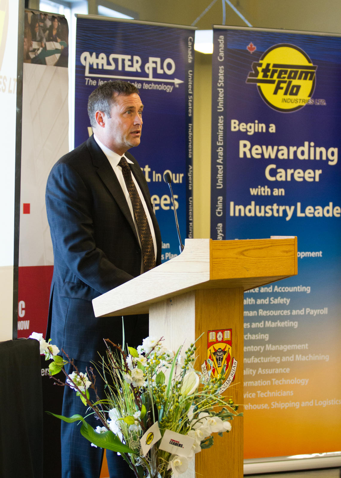Doug McNeill, executive vice-president business development with Stream-Flo Industries Ltd., speaks from the podium at the Schulich School of Engineering.