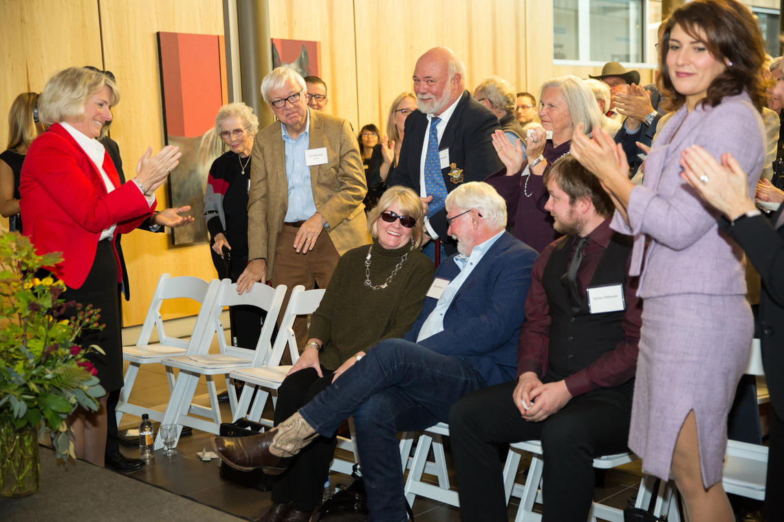 An appreciative audience at the Faculty of Veterinary Medicine Spy Hill Campus applauds the Anderson and Chisholm families for their generation donation.