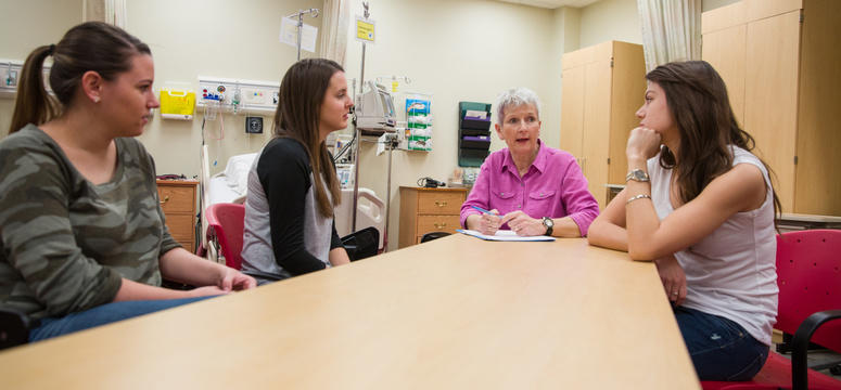 Meg McDonagh, a nurse practitioner and senior instructor in the Faculty of Nursing, works alongside university students and public health nurses at the five-year-old Airdrie Teen/Young Adult Clinic. Photo by Riley Brandt, University of Calgary