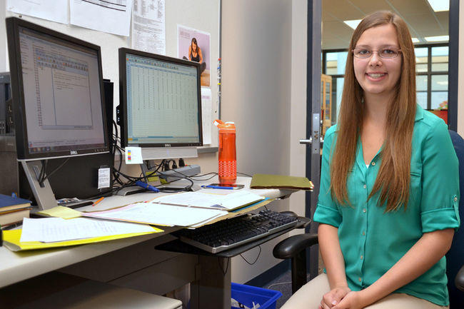 Miranda Schmidt, a student at Bert Church High School, is helping Dr. Karen Benzies with data input and analysis for a research project at the University of Calgary. 