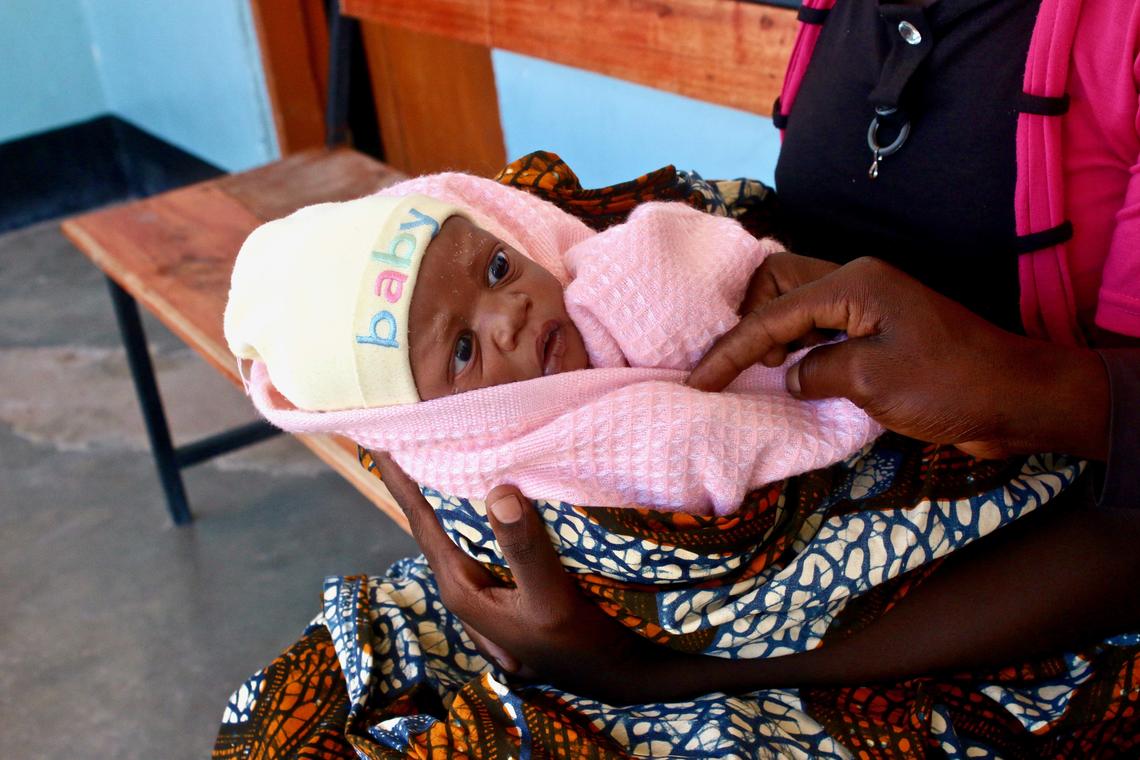 Known locally as Mama na Mtoto (mother and baby in Swahili), UCalgary's Cumming School of Medicine project provides on-the-ground clinical, education and research support to help mothers and babies. Here, a two-day-old baby awaits a checkup at a health facility in Misunwi District, Tanzania. Photo by Ashley Anderson