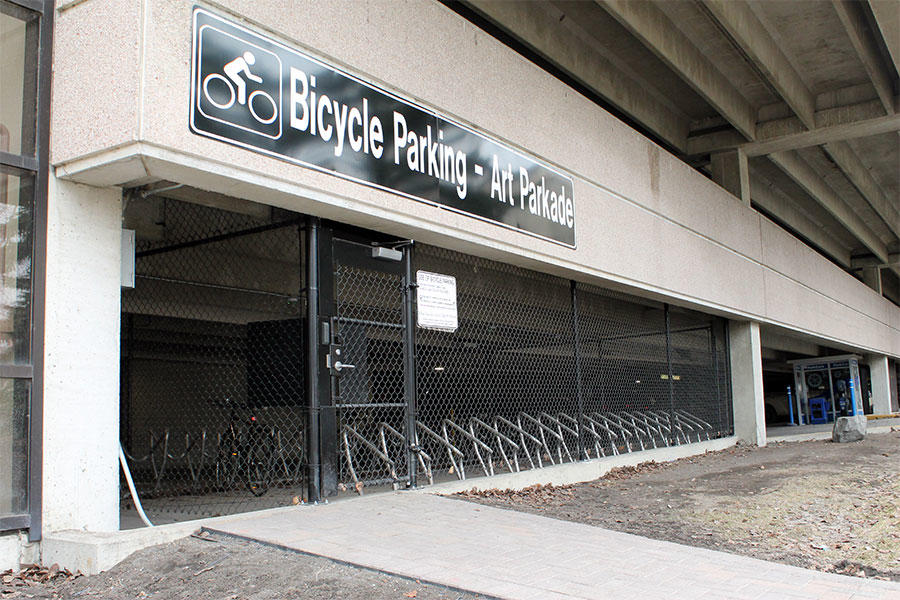 The secure bike compound is located in the southeast corner of the Arts Parkade, accessible from a pedestrian entrance on the east side.