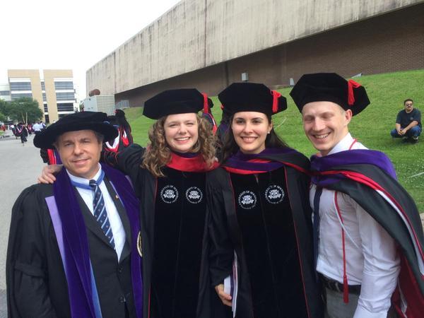 Ian Holloway, dean of the University of Calgary Faculty of Law, left, joins new IELP graduates Andrea James, Julia Gill and Barrett Schitka