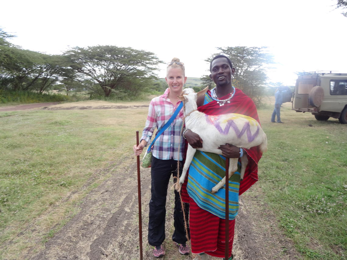 A Maasai warrior brings a ceremonial goat to Lisa Allen Scott at the University of Calgary’s One Health field school in the tiny village of Endulen.