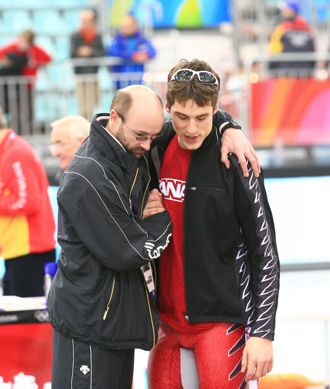 Marcel Lacroix with speedskater Denny Morrison after an Olympics race in Torino, Italy in 2006. 