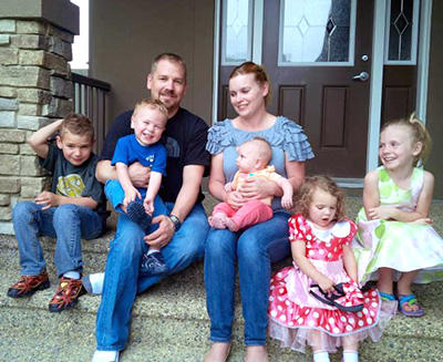 Members of the busy Sharpe family, from left: Callum, Lachlan, dad Jason, mom Heather, Piper, Sophie, and Josie.