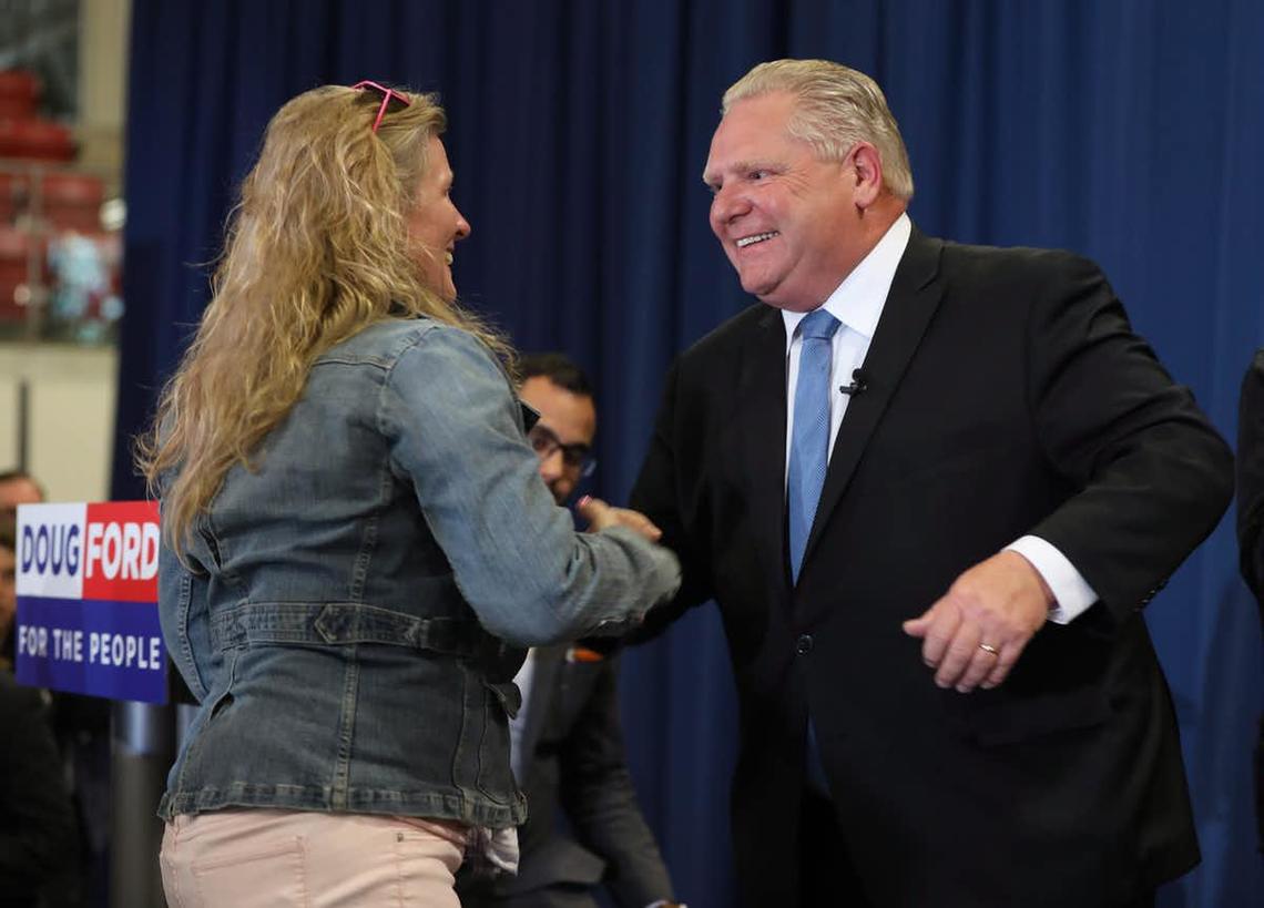 Progressive Conservative Leader Doug Ford greets a supporter at a rally at a school in Barrie, Ont., on May 11, 2018. Ford pledged to repeal the province’s sex-ed curriculum.