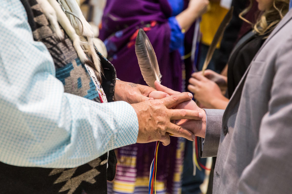 Eagle feather gifting in the Indigenous graduation ceremony