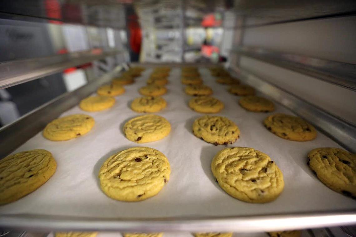 In this 2014 file photo, freshly baked cannabis-infused cookies cool on a rack inside a Denver-based gourmet marijuana edibles bakery.