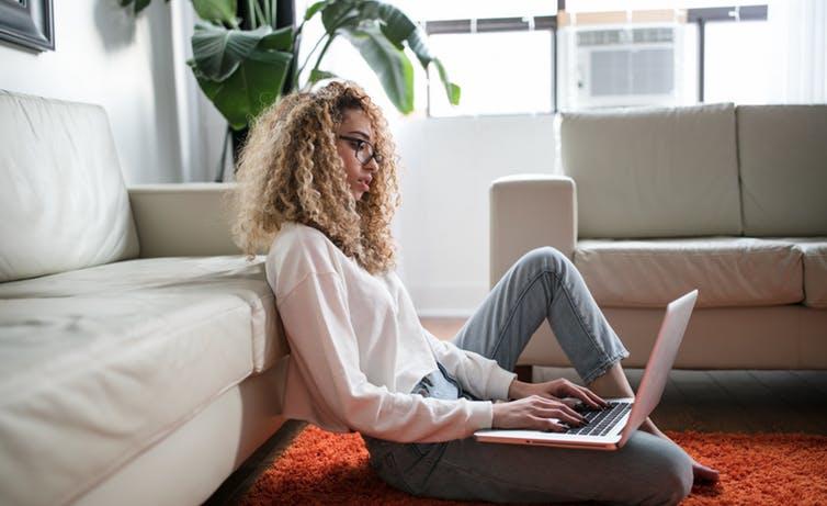 Woman working on laptop at home