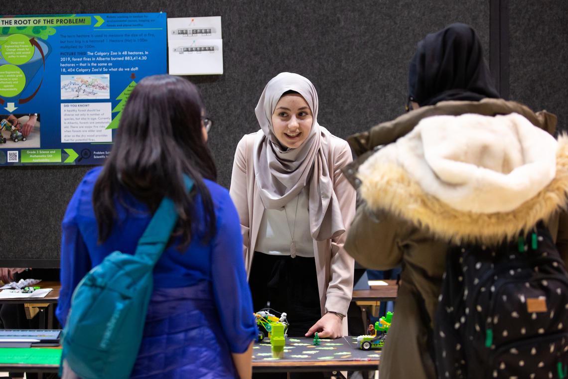 Bachelor of Education student Raneem Elhowari explains the role robots can play in preventing forest fires at the recent Werklund School STEM showcase. Photo by Riley Brandt, University of Calgary