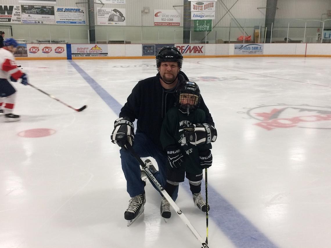 Van Hee and son Andrew at hockey practice
