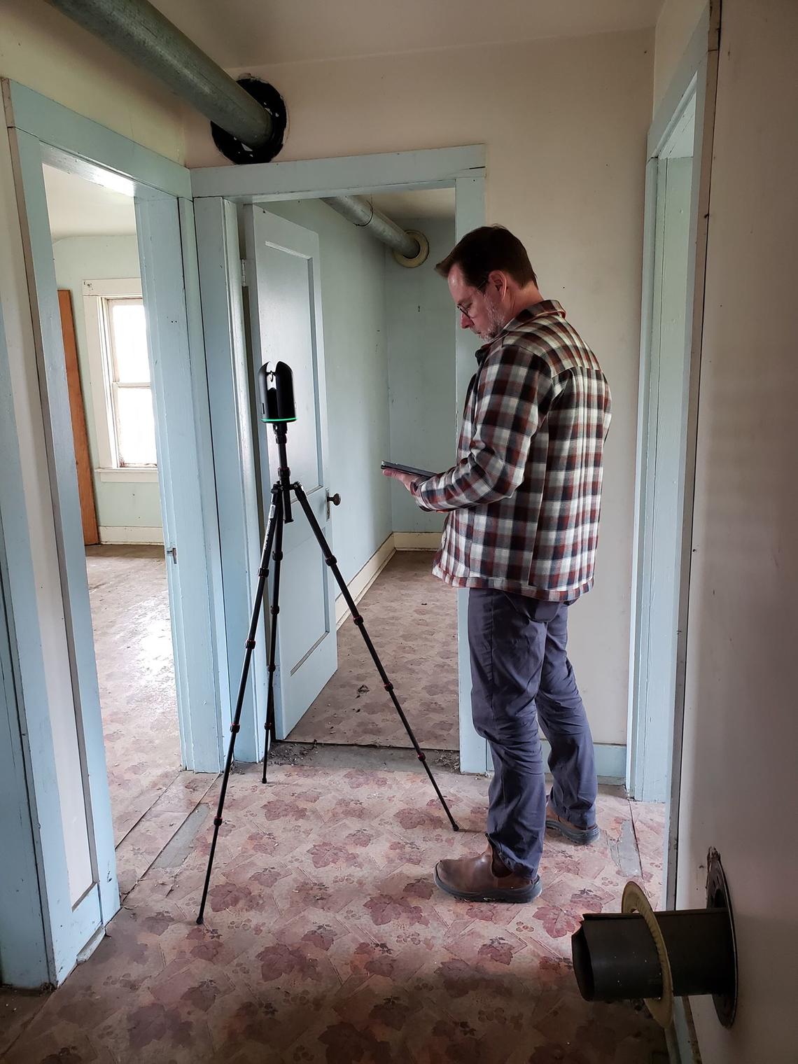 Peter Dawson, scans the interior of a heritage building