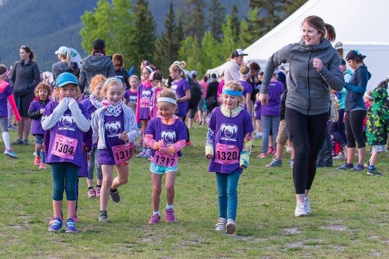 Kira Makuk plays warmup games with the girls as she volunteers for Fast and Female at the Rocky Mountain Soap Run in Canmore.